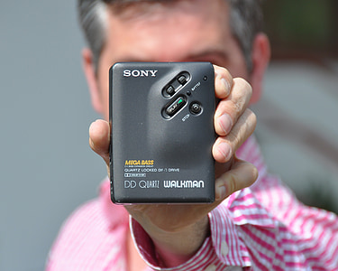 person holding black Sony DD walkman thumbnail
