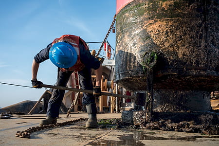 construction worker working machine during daytime thumbnail