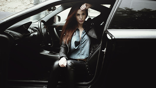 woman sitting on car driving seat during daytime thumbnail