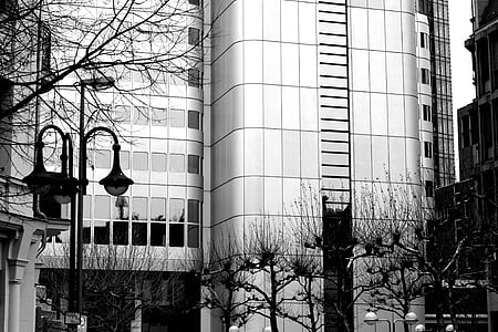 grayscale photography of curtain glass building thumbnail