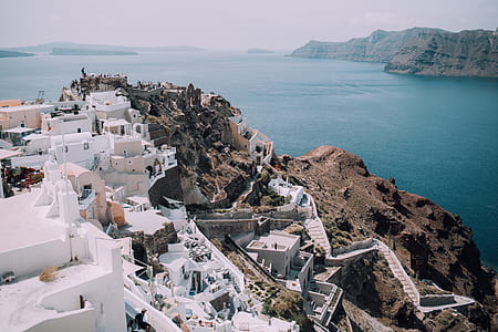 aerial photo of white houses near body of water thumbnail