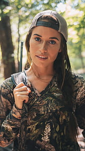 woman carrying backpack facing on camera thumbnail