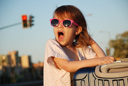 selective focus of girl opening her mouth wearing glasses thumbnail