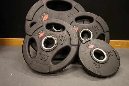 photo of four black weight plates thumbnail