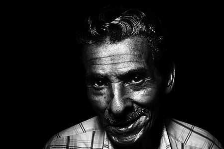 grayscale photograph of smiling man thumbnail