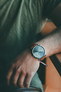 man sitting near brown table thumbnail