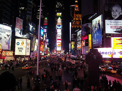 people walking on sidewalk in busy city thumbnail