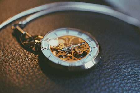 round silver-colored skeleton watch on cushion thumbnail