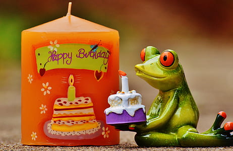 green frog ceramic figurine carrying cake thumbnail