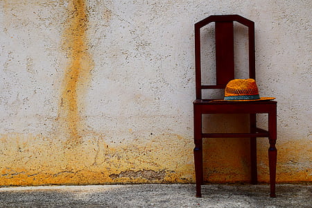 brown wooden chair with brown hat thumbnail