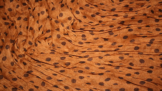 brown and black polka-dot textile thumbnail