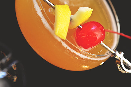 Closeup shot of a cocktail and cherry drink thumbnail