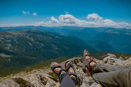 two person sitting on mountain cliff thumbnail
