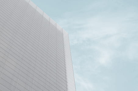 grey concrete building under the blue sky thumbnail