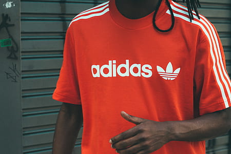 man wearing red Adidas crew-neck t-shirt thumbnail