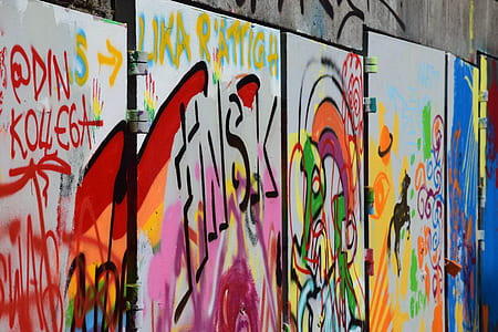 assorted grafitti on gray wall thumbnail
