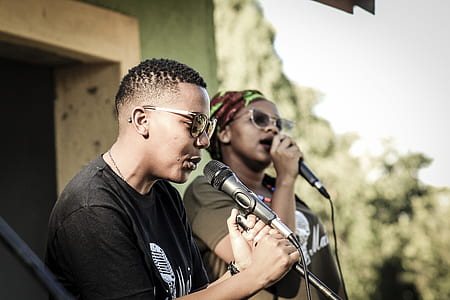 two men singing on microphone thumbnail