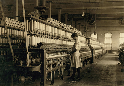 woman standing in front of industrial machine thumbnail
