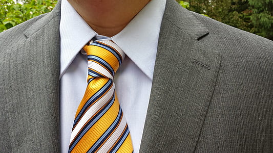 man in gray notched lapel suit jacket with white inner dress shirt thumbnail