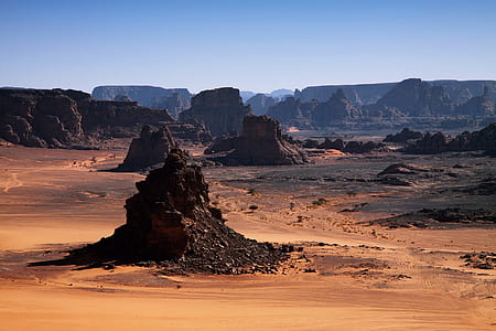 rock surrounded with sand thumbnail