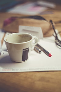 white ceramic mug on printer paper thumbnail