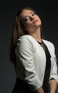 woman wearing grey crop blazer while leaning her head backward thumbnail