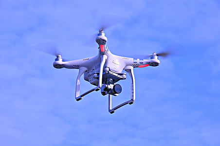 flying white DJI drone thumbnail