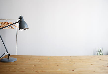 gray table lamp on brown wooden table thumbnail