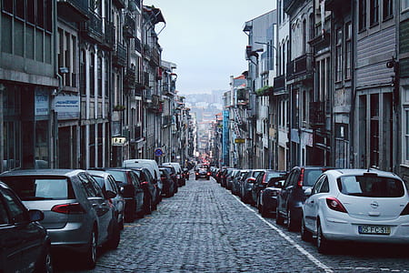 vehicle on road beside buildings thumbnail