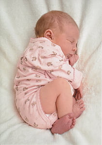 baby wearing pink onesie thumbnail