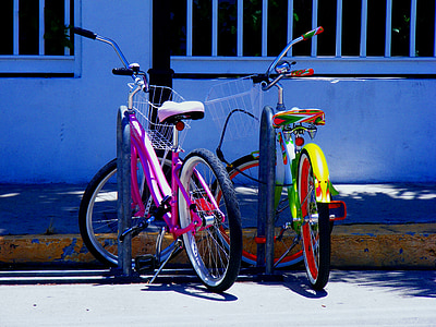 two green and purple bike near wall thumbnail