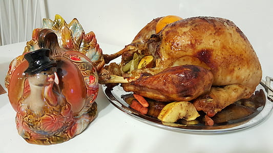roasted chicken beside ceramic turkey figurine thumbnail
