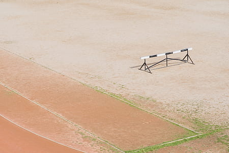 white and black bar on brown oval track thumbnail