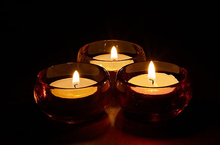 three lighted tealights thumbnail