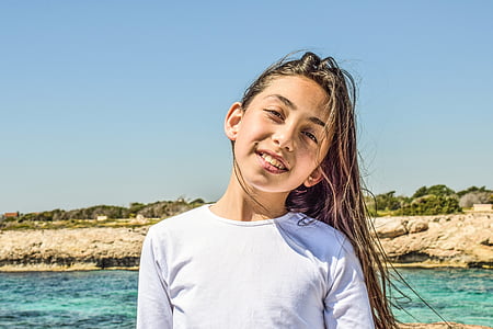 girl standing near body of water thumbnail