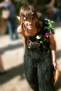 man wearing green fur costume thumbnail