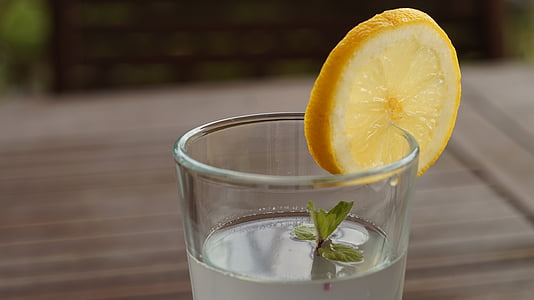 shallow depth of field photography of clear glass cup filled with gray substance thumbnail