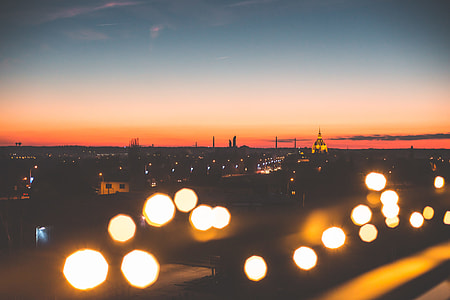 Sunset Cityscape with Bokeh Lights thumbnail