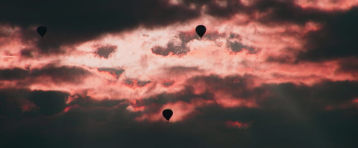 two hot air balloons flying thumbnail