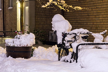 snow covered black bicycle thumbnail