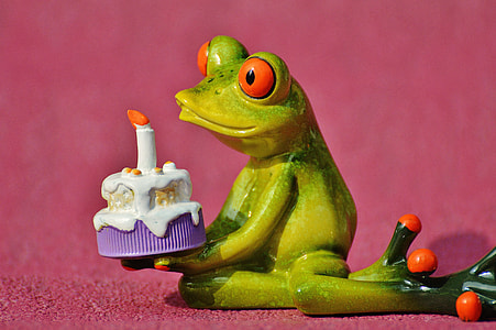 frog holds cake figurine thumbnail