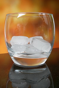 clear drinking glass on black table thumbnail