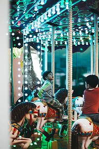 boy riding carousel starring at ceiling with LED lights thumbnail