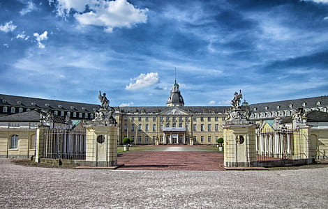 yellow and gray palace under blue sky during daytime thumbnail