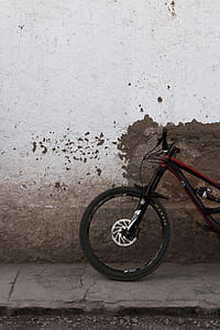 black and red hardtail bicycle in front of wall thumbnail