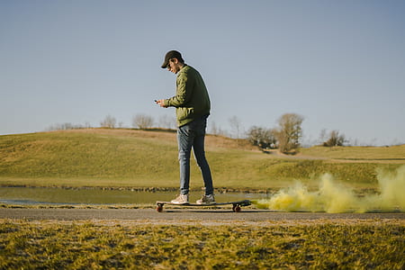 man standing on skateboard with green smoke screen thumbnail