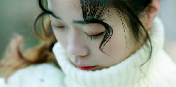 Close Up Photo of Woman in White Turtle Neck Top thumbnail
