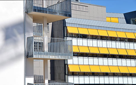 white, yellow, and green concrete building thumbnail