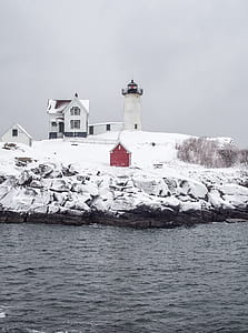 white concrete house during winter season thumbnail