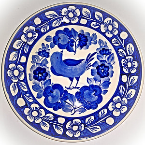 closeup photo of white and blue bird-printed plate thumbnail